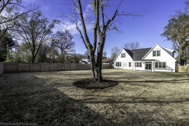 view of yard with a fenced backyard