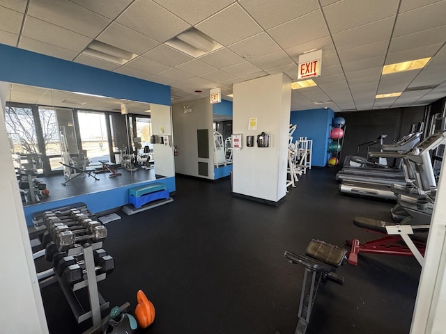 exercise room featuring a drop ceiling