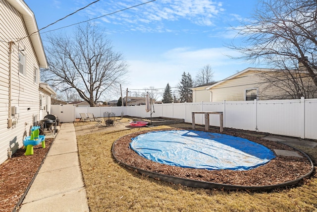 view of swimming pool with a patio area and a fenced backyard