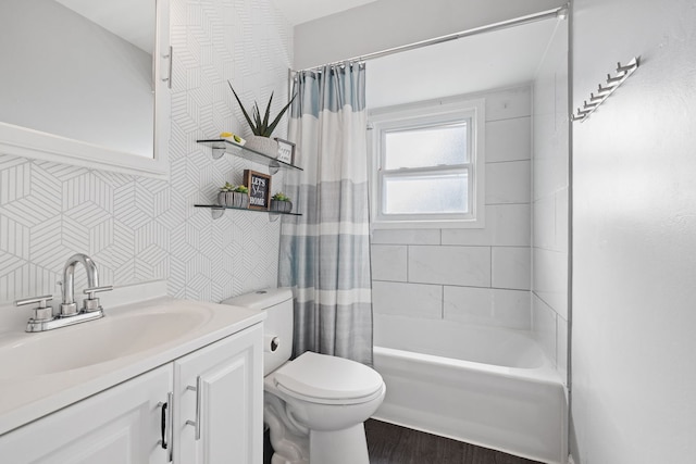 bathroom featuring tile walls, shower / bath combo with shower curtain, toilet, wood finished floors, and vanity