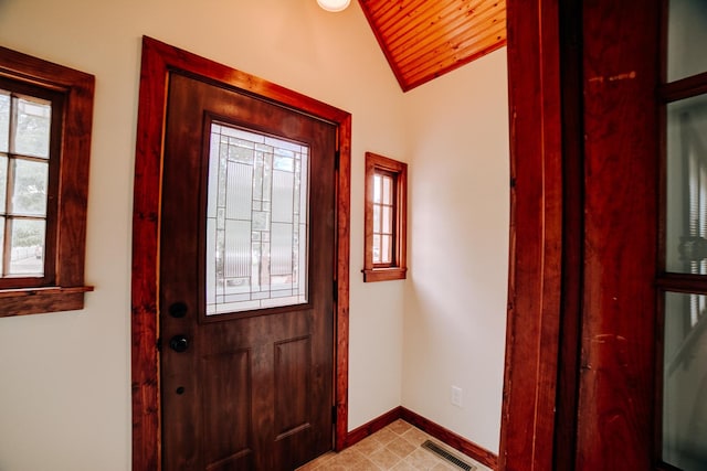 319 S 3rd St, Watseka, IL 60970 - foyer entrance with baseboards, lofted ceiling, and wood ceiling