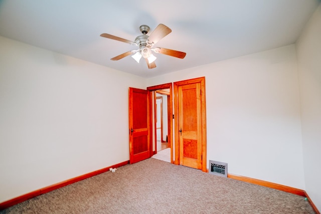 319 S 3rd St, Watseka, IL 60970 - carpeted empty room featuring ceiling fan and baseboards
