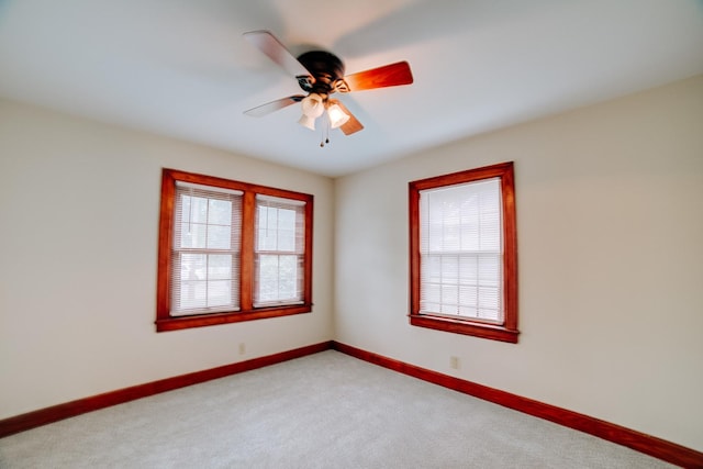319 S 3rd St, Watseka, IL 60970 - unfurnished room featuring light colored carpet, baseboards, and a ceiling fan