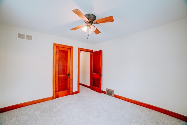 319 S 3rd St, Watseka, IL 60970 - unfurnished room with carpet, baseboards, and a ceiling fan