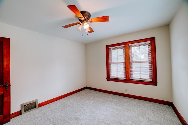319 S 3rd St, Watseka, IL 60970 - carpeted spare room featuring baseboards and ceiling fan