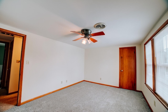 319 S 3rd St, Watseka, IL 60970 - carpeted spare room with a ceiling fan and baseboards