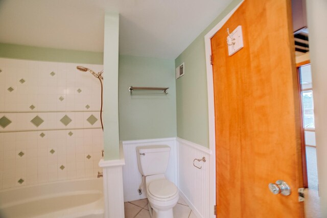 319 S 3rd St, Watseka, IL 60970 - full bathroom with toilet, wainscoting, shower / bathtub combination, and tile patterned flooring