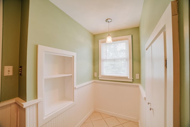 319 S 3rd St, Watseka, IL 60970 - unfurnished dining area with wainscoting and light tile patterned floors
