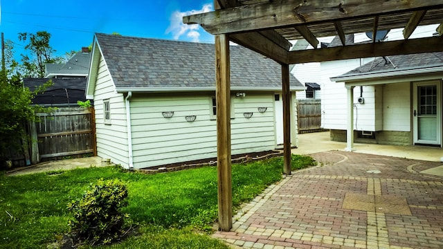 319 S 3rd St, Watseka, IL 60970 - view of patio with a pergola and an outbuilding