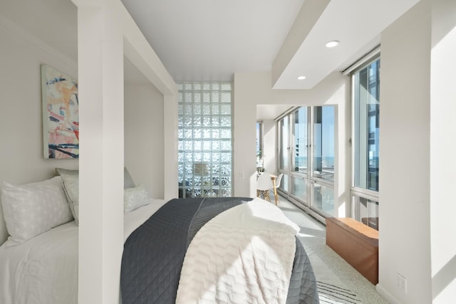 bedroom featuring recessed lighting, multiple windows, and access to outside