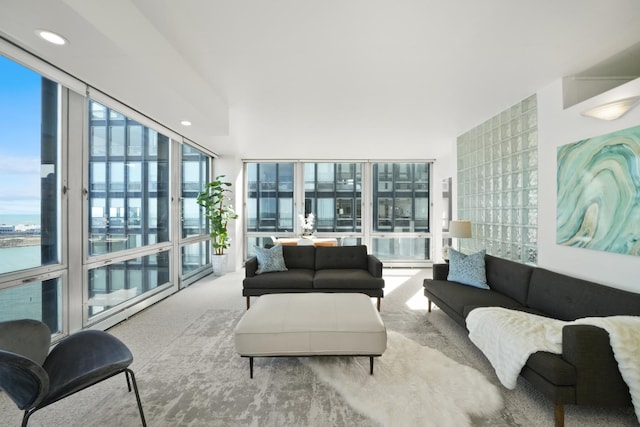 living room featuring a wealth of natural light, recessed lighting, carpet, and expansive windows