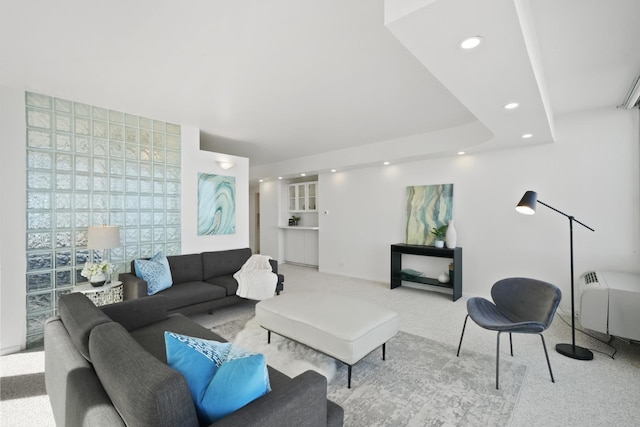 living room with recessed lighting and carpet floors