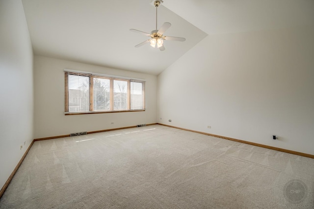 empty room featuring visible vents, baseboards, ceiling fan, light colored carpet, and lofted ceiling