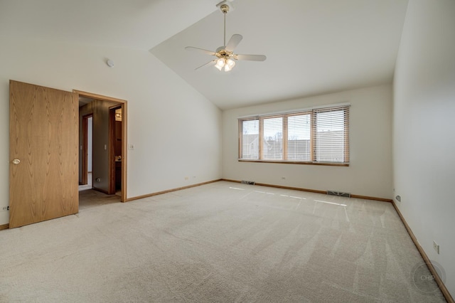 empty room with visible vents, a ceiling fan, carpet floors, baseboards, and vaulted ceiling