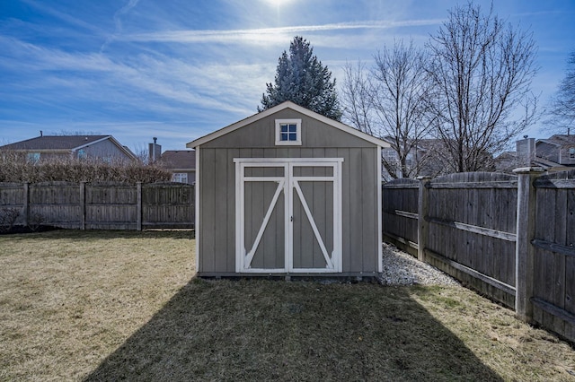 view of shed featuring a fenced backyard