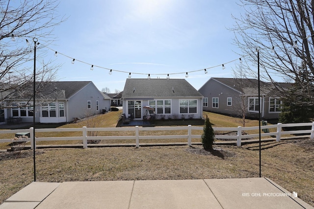 bungalow-style home with a fenced front yard