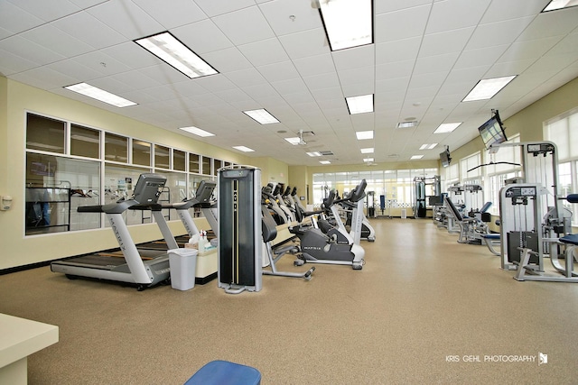 gym featuring a paneled ceiling