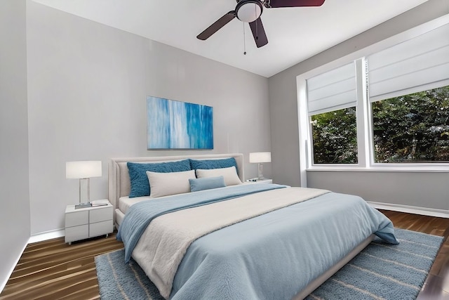 216 W 105th St, Chicago, IL 60628 - bedroom featuring a ceiling fan, baseboards, and wood finished floors