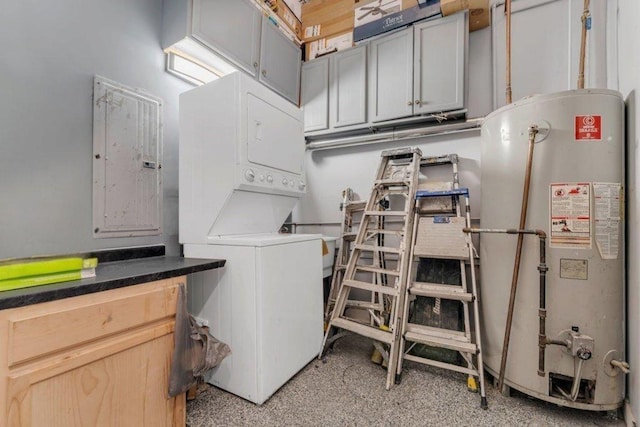 216 W 105th St, Chicago, IL 60628 - laundry room with cabinet space, gas water heater, stacked washer and clothes dryer, and electric panel