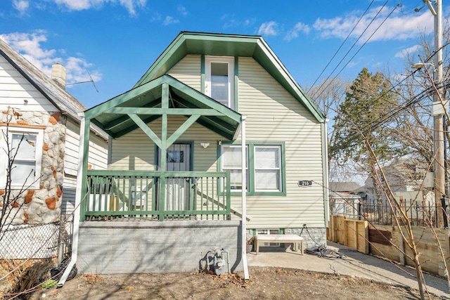 216 W 105th St, Chicago, IL 60628 - back of house featuring a patio area and fence