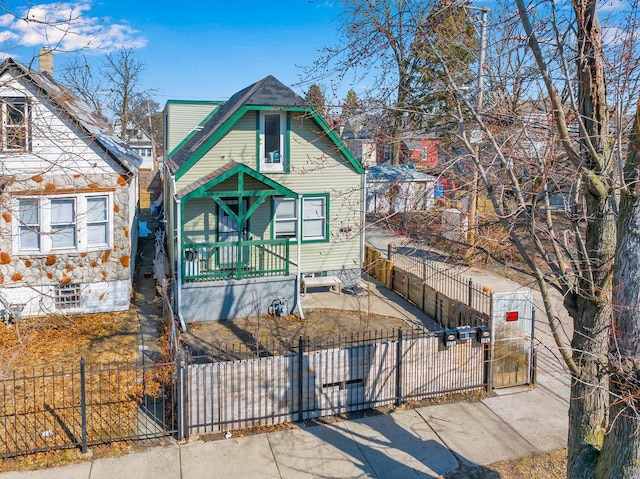 216 W 105th St, Chicago, IL 60628 - view of front of house featuring a fenced front yard and a gate