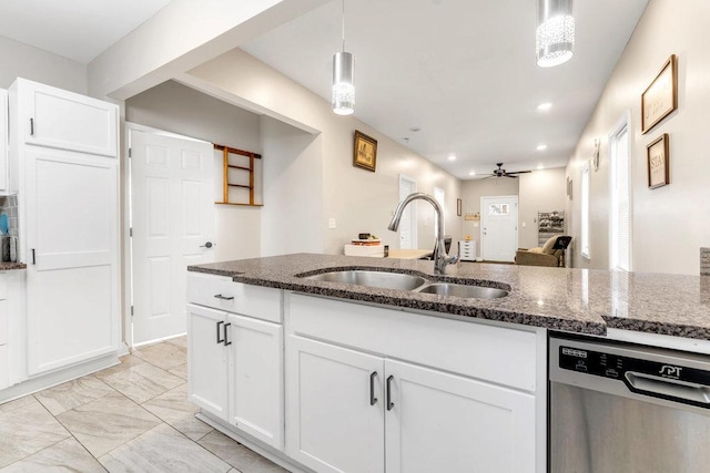 216 W 105th St, Chicago, IL 60628 - kitchen featuring dark stone countertops, white cabinetry, ceiling fan, a sink, and dishwasher
