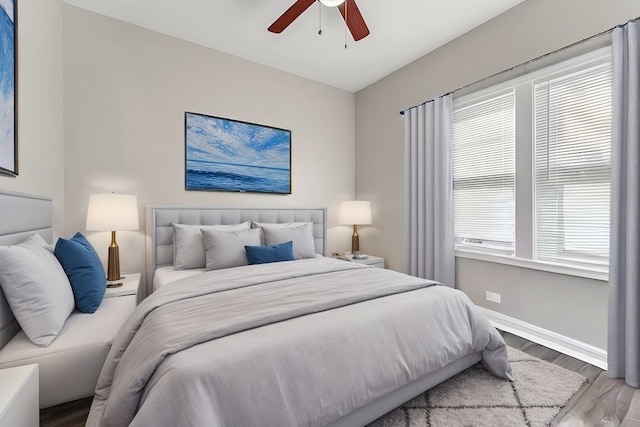 216 W 105th St, Chicago, IL 60628 - bedroom with ceiling fan, baseboards, and wood finished floors