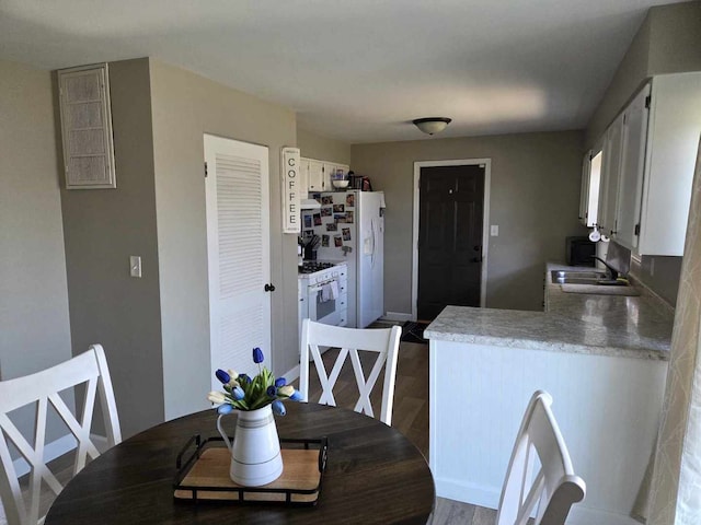 dining room with dark wood-style floors