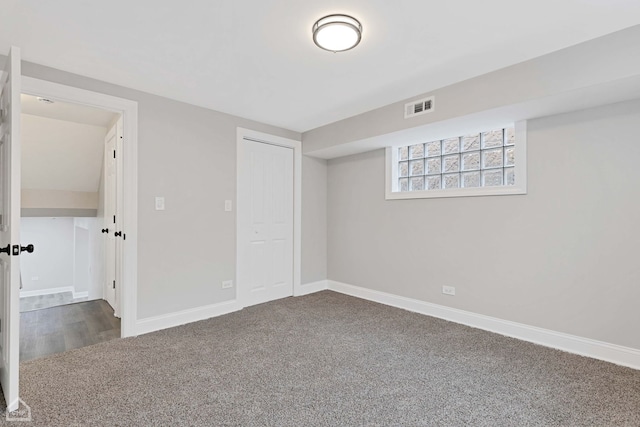 interior space featuring visible vents, baseboards, and carpet floors