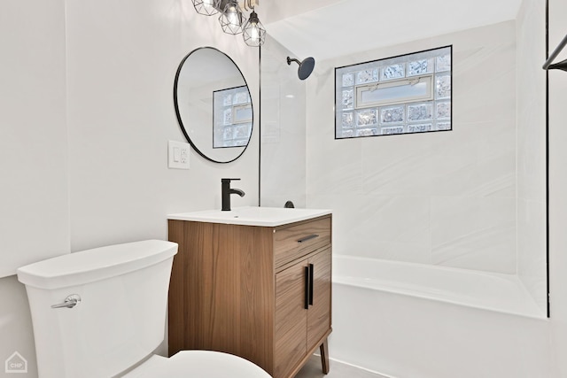 bathroom with vanity, toilet, and shower / washtub combination