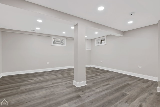 below grade area featuring recessed lighting, baseboards, and wood finished floors