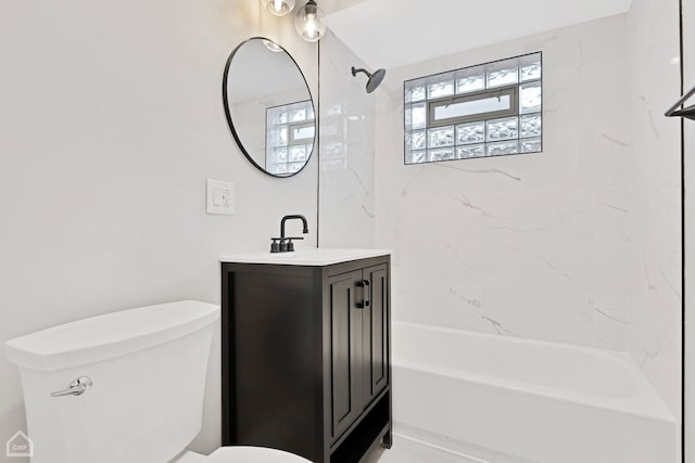 full bathroom with vanity, toilet, and  shower combination