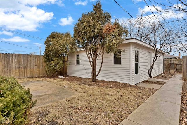 view of property exterior with fence