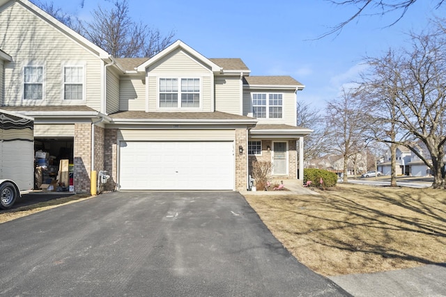 view of front of house with a garage, brick siding, roof with shingles, and driveway