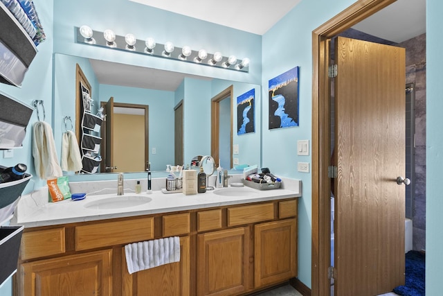 full bath with a sink and double vanity