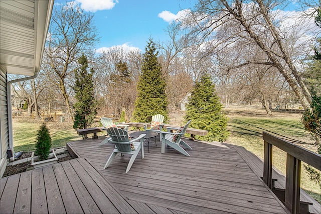 wooden deck with a lawn