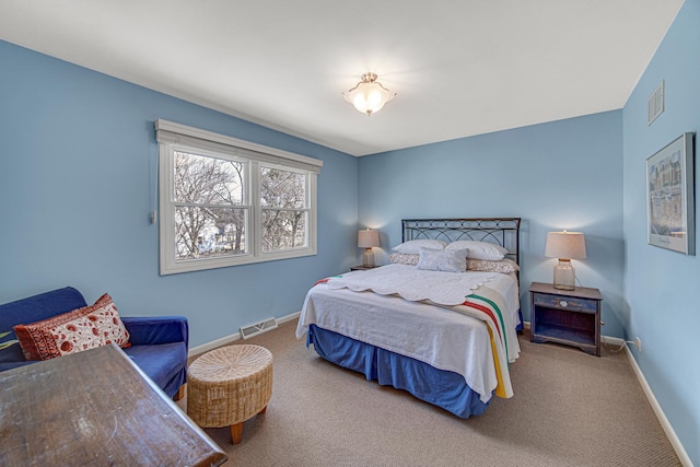 bedroom with visible vents, baseboards, and carpet floors