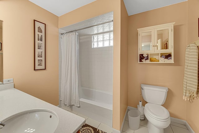 full bath with vanity, baseboards, tile patterned flooring, shower / bath combination with curtain, and toilet