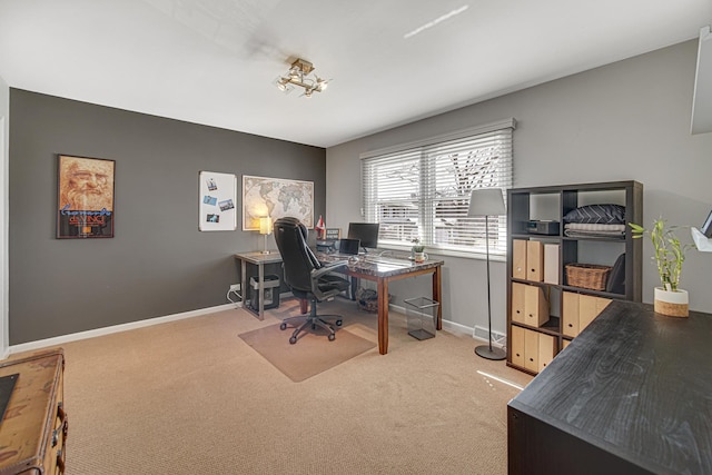 home office featuring carpet flooring and baseboards