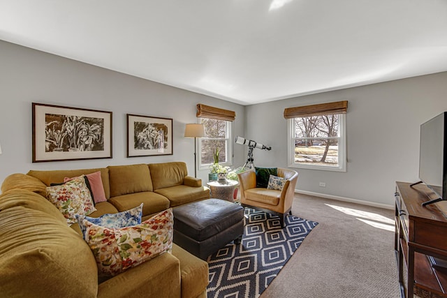 carpeted living area featuring baseboards