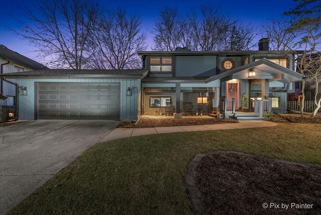 view of front of property with concrete driveway, a porch, and a garage