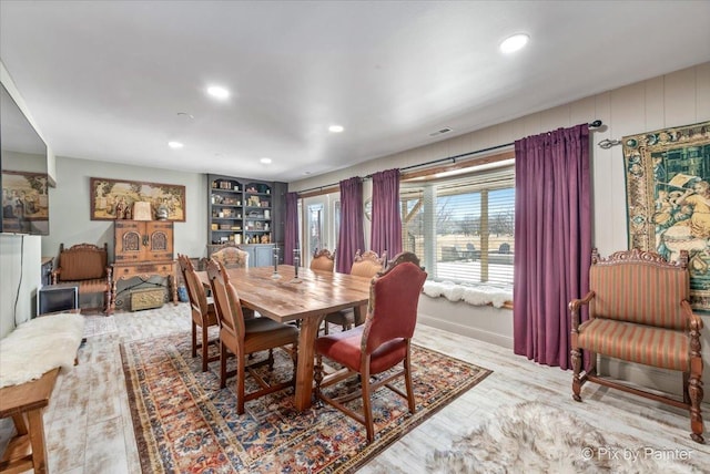 dining room featuring recessed lighting, visible vents, and wood finished floors