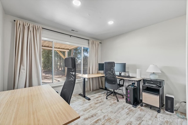 home office featuring recessed lighting, wood finished floors, and visible vents