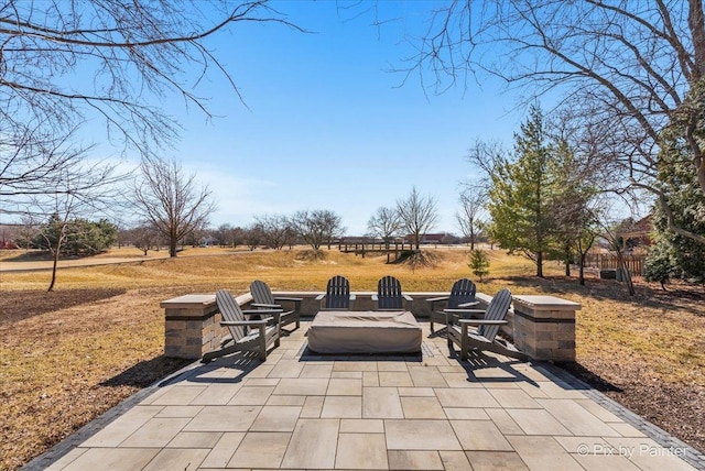 view of patio featuring an outdoor fire pit