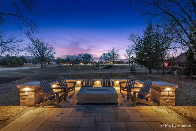 view of patio terrace at dusk