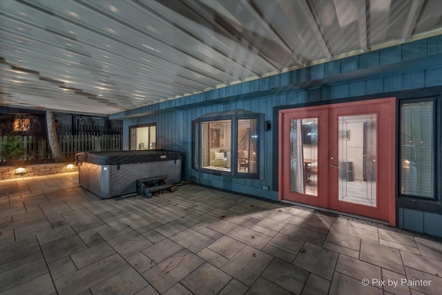 view of patio / terrace with french doors and an indoor hot tub