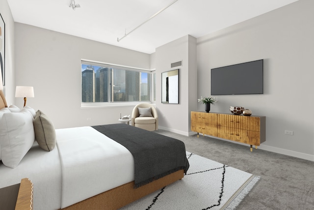 bedroom with visible vents, baseboards, and carpet