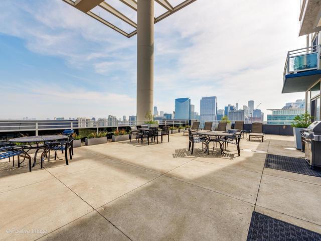 view of patio featuring a city view and outdoor dining space