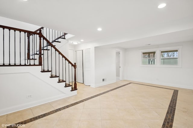 interior space featuring recessed lighting, baseboards, stairs, and tile patterned floors