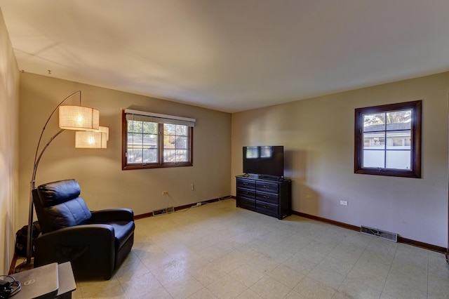 sitting room featuring visible vents and baseboards